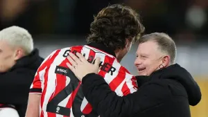 Mark Robins and Sam Gallagher after the final whistle (Bradley Collyer/PA)