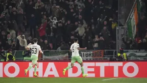 Auston Trusty, right, celebrates his goal in front of the Celtic fans (Massimo Paolone/LaPresse via AP)