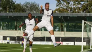Michael Cheek celebrates scoring (Steven Paston/PA)