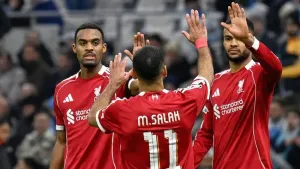Liverpool’s Cody Gakpo, right, celebrates with Liverpool’s Mohamed Salah, centre, and Liverpool’s Ryan Gravenberch after the