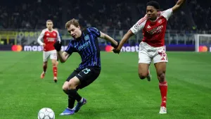 Arsenal’s Myles Lewis-Skelly, right, battles for the ball (Fabrizio Carabelli/PA)