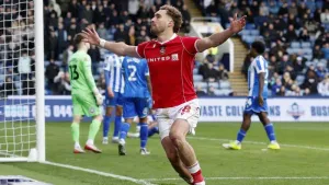 Sam Smith celebrates the winner (Cody Froggatt/PA)