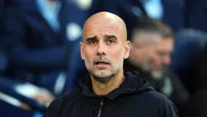 Pep Guardiola is committed to seeing out his contract at Manchester City (Martin Rickett/PA)