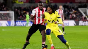 Brentford’s Michael Kayode (left) and Tottenham’s Djed Spence battle for the ball during the Premier League match at the Gte