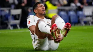 Real Madrid’s Jude Bellingham lies on the pitch injured during the La Liga game against Rayo Vallecano (Manu Fernandez/AP)