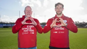 Every Minute Matters campaign ambassador Tom Lockyer alongside Wrexham fan and cardiac arrest survivor Maurice Jones, who ar